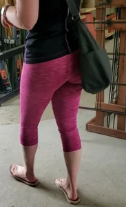 Milf shopping with a nice ass in tight maroon leggings