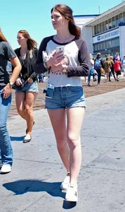 Cute girl walking in short jean shorts