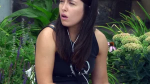 Thick brunette listening to music in shorts