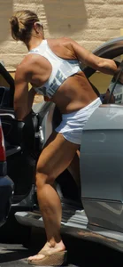 Fit babe in white shorts with big boobs in athletic top