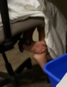 Feet of a Young Girl Sitting in an Office Chair