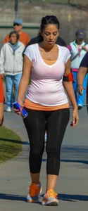 Thick lady walking in leggings with a big booty