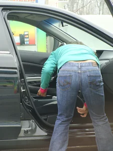 Girls cleaning their cars in jeans and pants