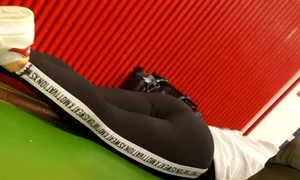 Candid Girl in Yoga Pants and Sneakers Working Out on the Floor
