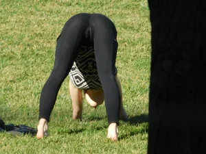 Girl in Leggings Doing Yoga on the Grass in a Park Cameltoe Candid Photo