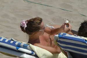 Girls on a nude beach in Sitges, Spain