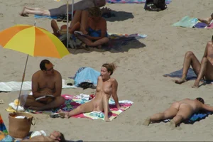 Girls on a nude beach in Sitges, Spain