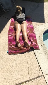 Candid Girl in Panties Lying on Her Stomach With a Laptop Poolside Creepshot