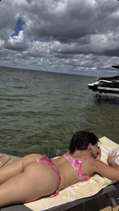 Juicy Candid Girl in a Pink Swimsuit Lying on a Sunbed Creepshot