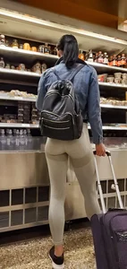 Beautiful brunette shopping in tight grey spandex with a great ass