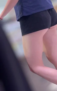 Sexy fit ass in mini shorts and slim legs closeups
