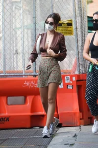 Emily Ratajkowski in mini skirt out for a walk with a friend in New York