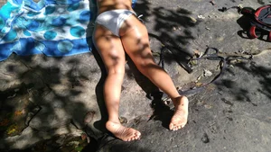 Sexy bikini ass laying out on the rocks up close