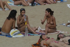 Topless girls on a beach in Barcelona