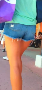 Candid girl in denim shorts with nice legs and showing her cheeks