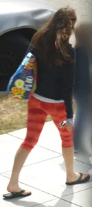 Beautiful brunette teen in orange patterned leggings
