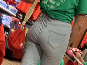 Bunch of girls in various outfits at a Cardinals baseball game