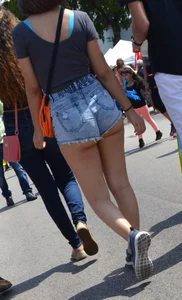 Thick booty babe in denim shorts showing her cheeks