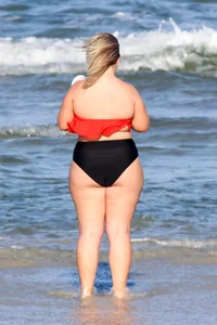 Thick BBW blonde lady in a bikini at the beach