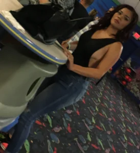 Thick brunette in tight jeans and showing some side boob