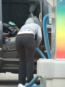 Girls cleaning their cars in jeans and pants