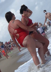 Fat chick on the beach in a red swimsuit