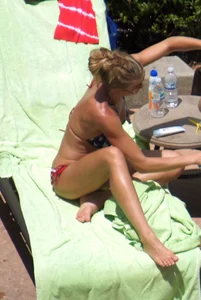Blonde babe at the pool with sexy body in USA bikini
