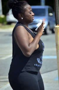 Chubby black lady with big tits and no bra lets it slip