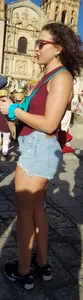 Laughing girl in shorts, legs and thick peach