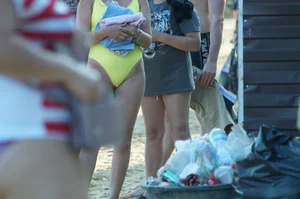 Sexy Girl in One-Piece Yellow Swimsuit Walking on the Beach Candid Photo Gallery