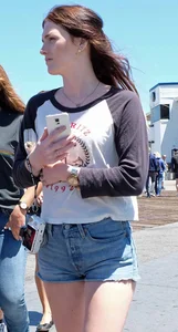 Cute girl walking in short jean shorts