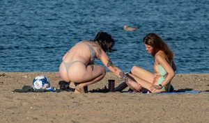 Ladies literally making out on beach
