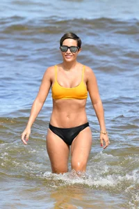 Frankie Bridge nip slips in a bikini on the beach