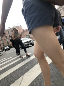 Young Girl in Shorts And Sandals Crossing the Street Gallery