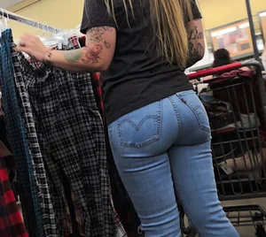 Girl with tattoos in tight jeans