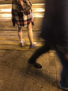 Cute Teen in Shorts on the Tram Stop