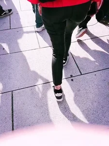 Ass in leather pants closeups on the street
