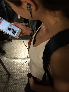 Sexy Asian showing bra under shirt and a little cleavage