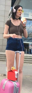 Girl in a Top and Tight Denim Mini Shorts With Hot Legs With a Suitcase Street Creepshot
