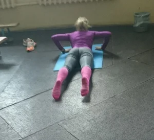 Girl in Yoga Pants and Pink Knee Socks Working Out on the Yoga Mat Creepshots