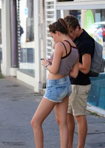 Beautiful teen out with boyfriend in short jean shorts
