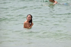 Two sexy ass girls on the beach in bikinis