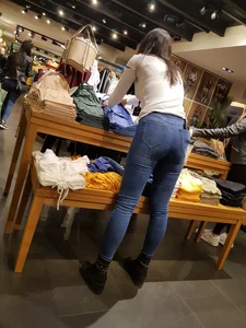Sexy clothing store employee with a nice ass in tight jeans