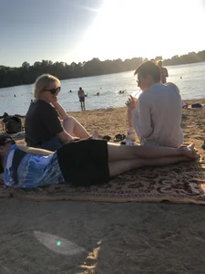 Barefoot Candid Girl in a Skirt Lying on a Lake Beach Creepshot