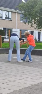 Tall candid teen wearing tight jeans playing on the street