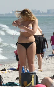 Big boobed thick blonde on the beach in a bikini