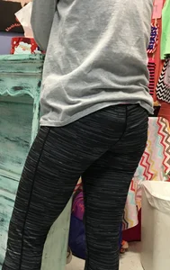 Ass standing around in tight grey patterned leggings