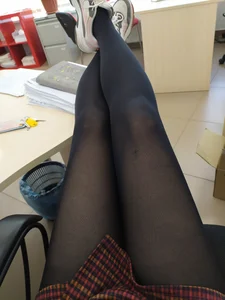 Legs in Black Pantyhose on the Table Office Selfie