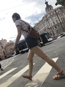 Young Girl in Shorts And Sandals Crossing the Street Gallery