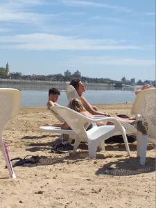 Blonde beach girl with a great ass in pink thong bikini